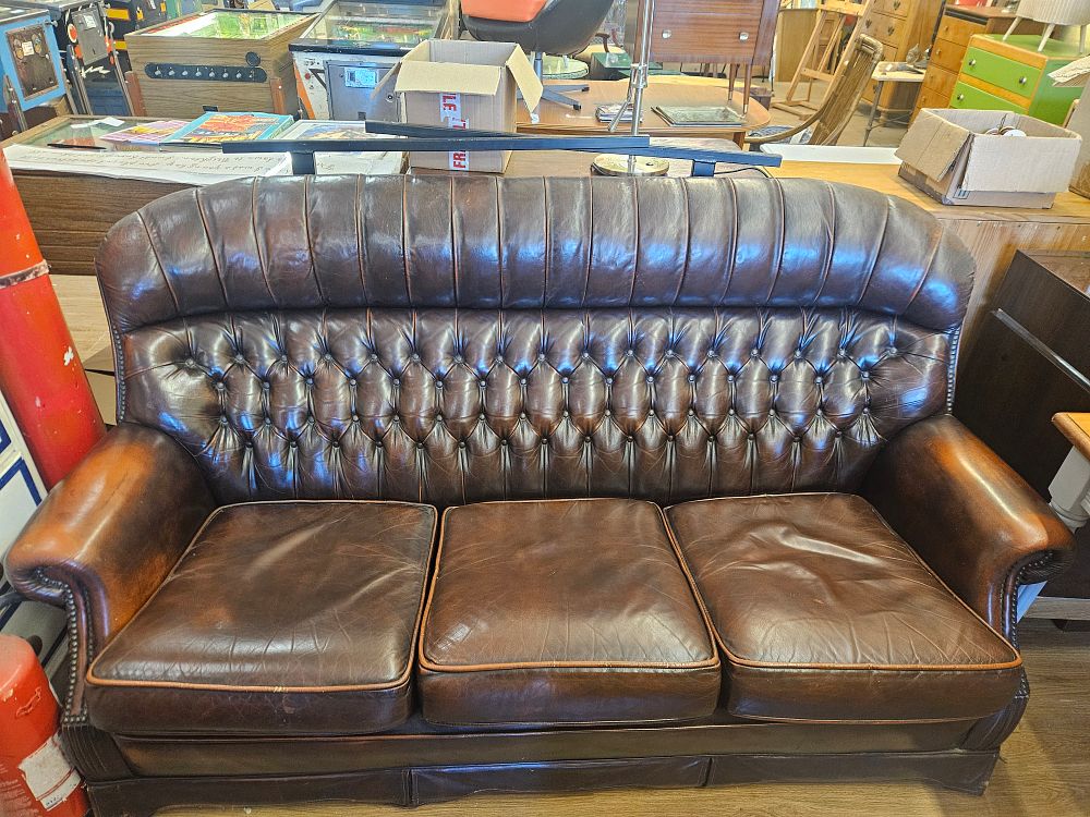 Lot 161 – A Vintage Three-Seater Scalloped Back Chesterfield Leather Sofa
