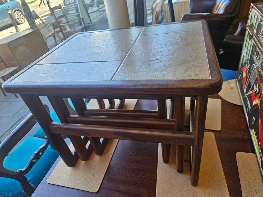 Lot 175 – A Trio of Mid-Century Modern Teak Nesting Tables with Inset Tile Top