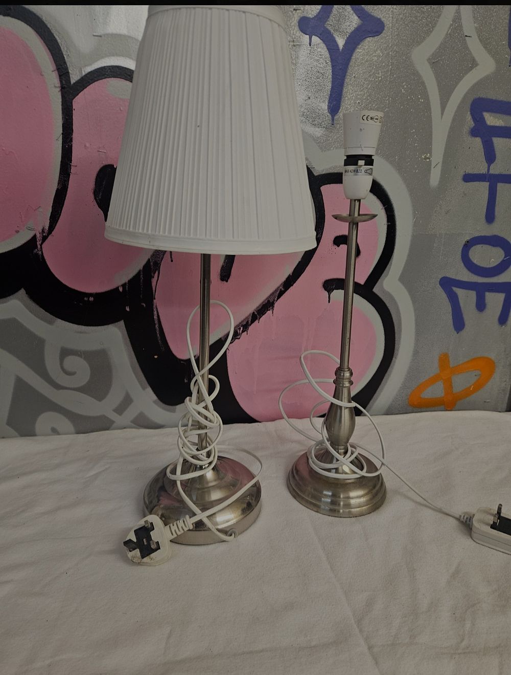 Lot 260 – A Pair of Nickel-Plated Table Lamps in the IKEA ÅRSTID Style