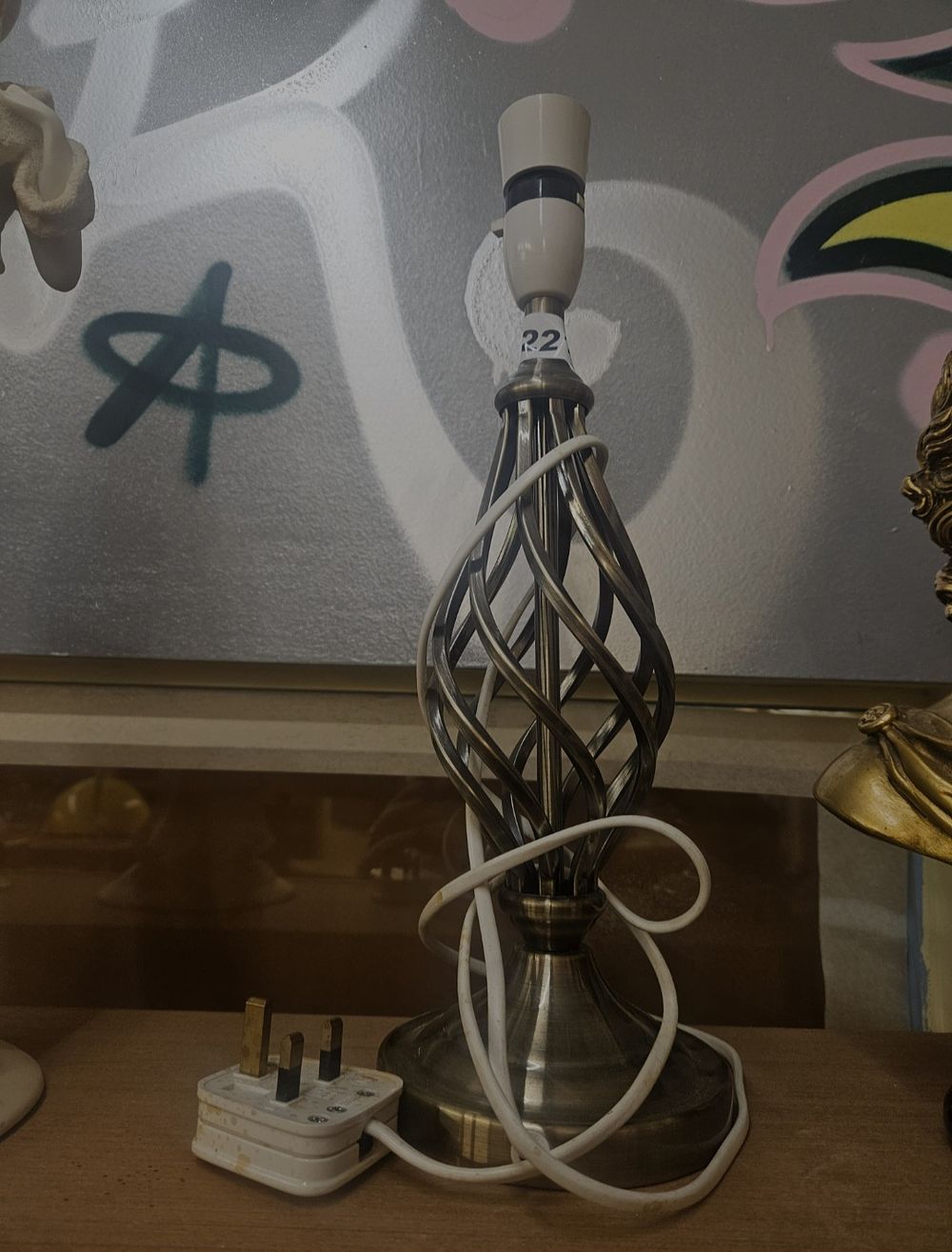 Lot 262 – A contemporary antiqued brass finish spiral cage table lamp base