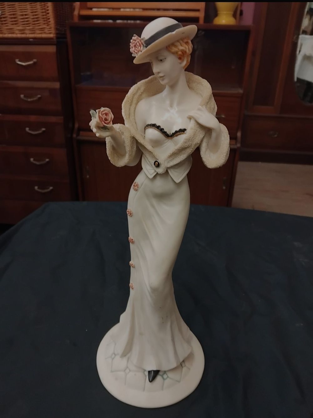 Lot 318 – A large bisque porcelain figure of a lady holding a rose, attributed to Giuseppe Armani