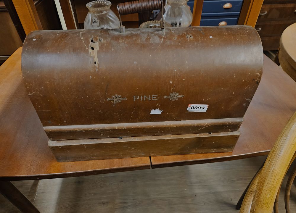 Lot 330 – A Pine Sewing Machine Mfg. Co. Hand-Cranked Sewing Machine with Domed Wooden Case