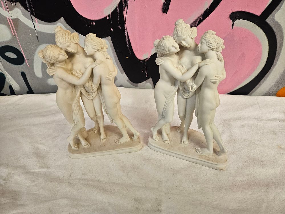 Lot 409 – A Pair of Neoclassical Style Composite Figural Groups After Antonio Canova’s The Three Graces