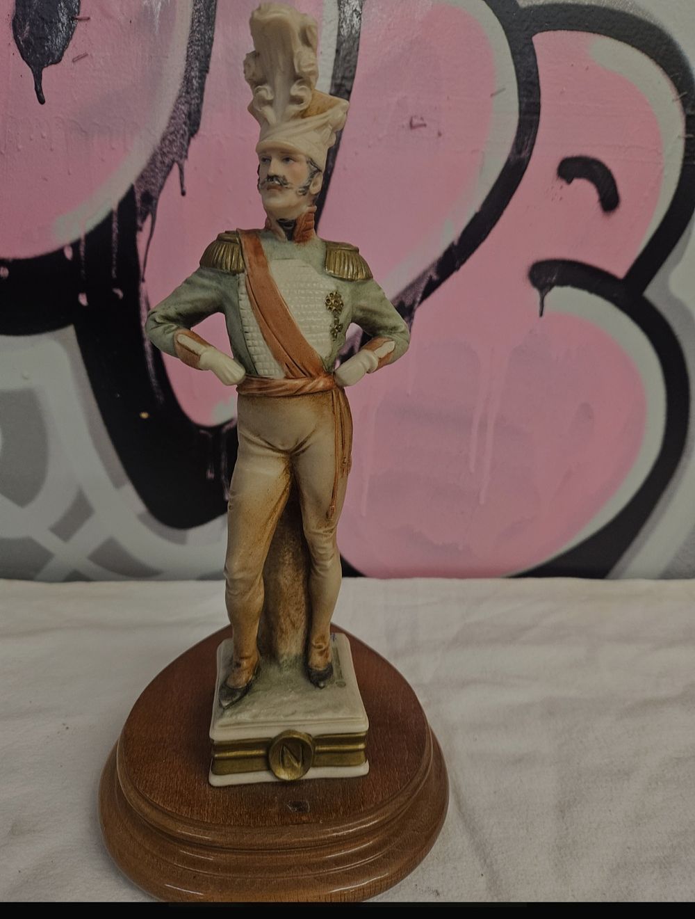 Lot 412 – A Capodimonte style hand painted bisque porcelain figurine of a Napoleonic officer