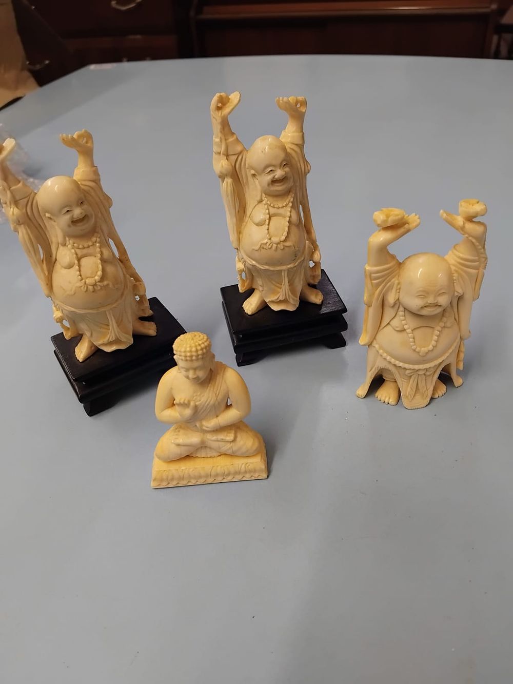 Lot 423 – A Group of Chinese-Style Carved Figures Representing Budai and Buddha