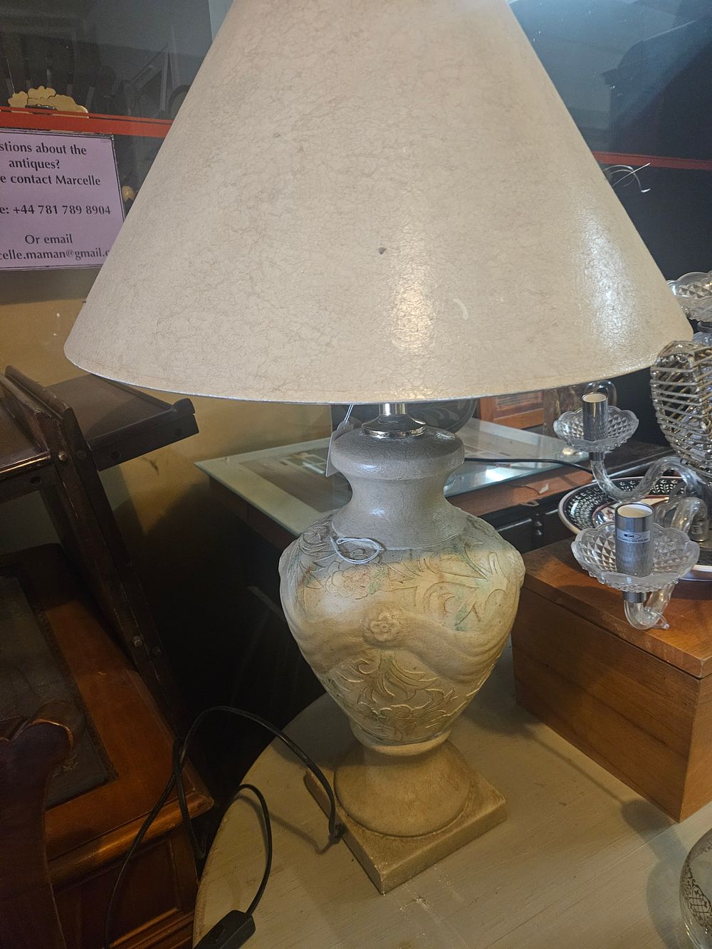 Lot 300e – A Decorative Relief-Moulded Ceramic Table Lamp with Parchment-Effect Shade
