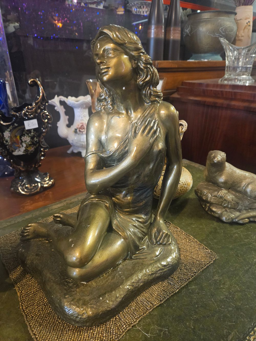 Lot 300m – A Late 19th or Early 20th Century Bronze-Patinated Spelter Sculpture of a Crouching Female Figure