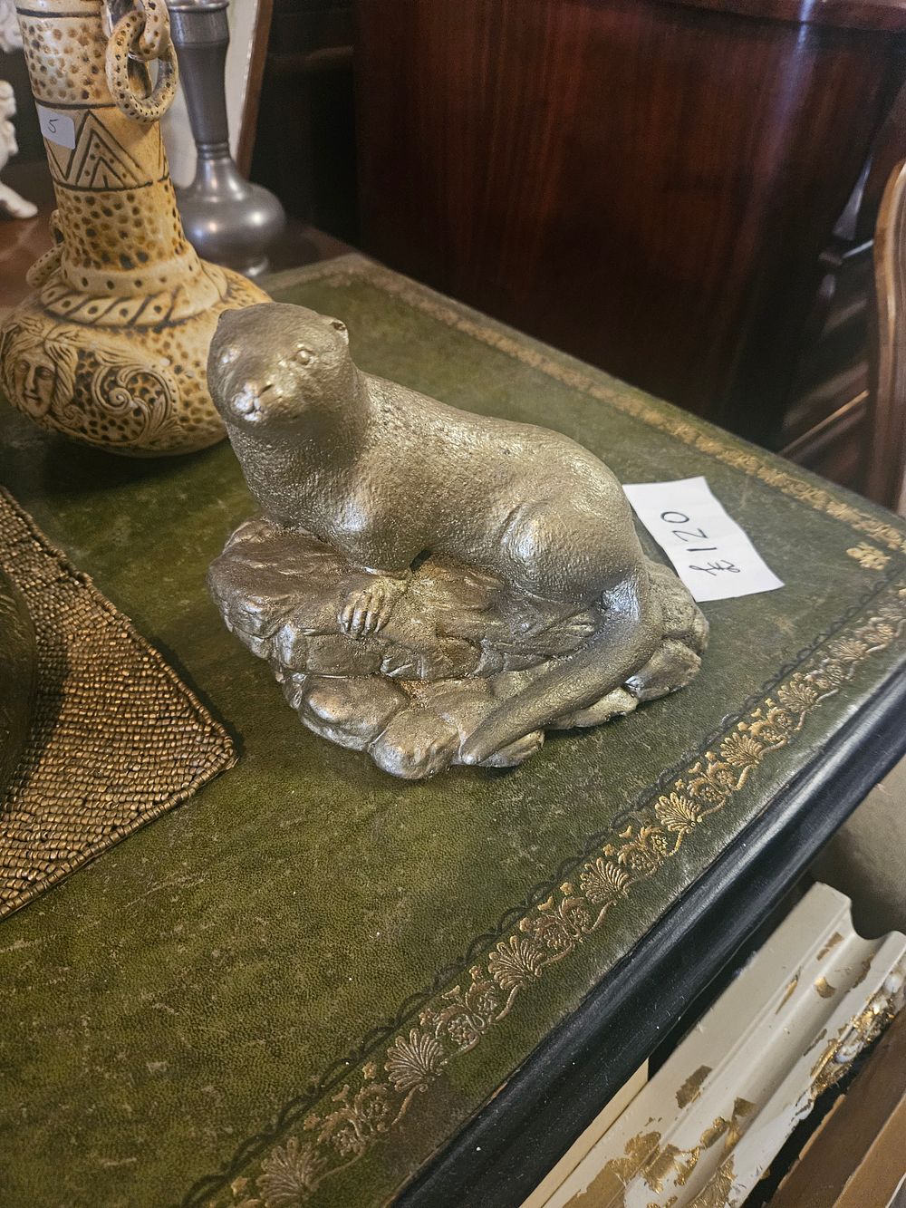 Lot 300n – A Silvered Cast Metal Sculpture of an Otter on a Rocky Base