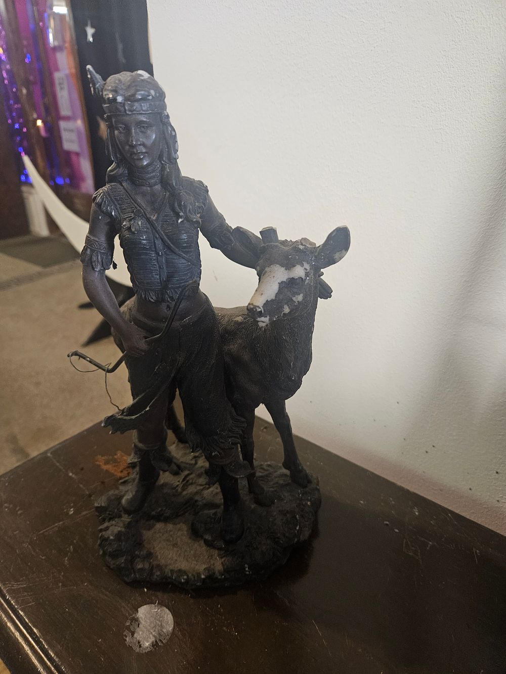 Lot 300t – A Cold-cast Resin Sculpture of a Native American Male and Fawn