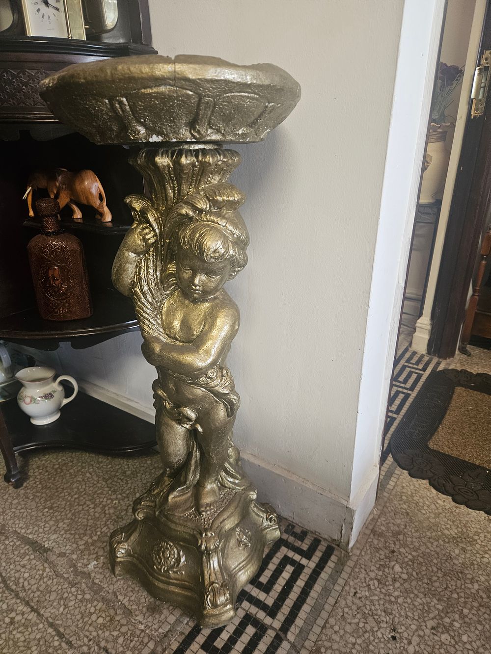 Lot 300y – A Classical Revival Gilded Composite Pedestal Stand Featuring a Cherub with Wheat