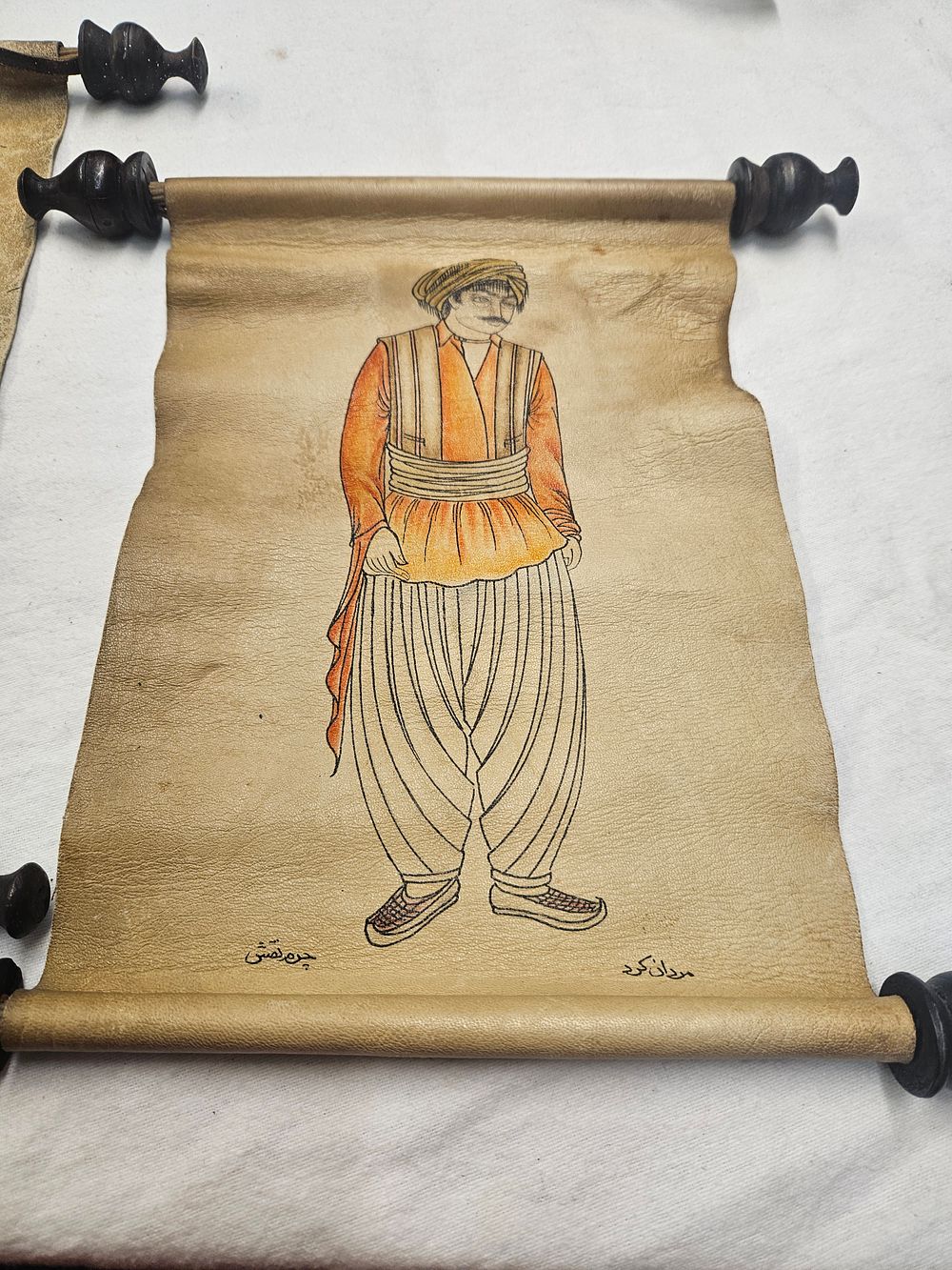 Lot 313 – A Pair of Persian Hand-Painted Animal Hide Scrolls Depicting Ethnic Kurdish and Qashqai Figures