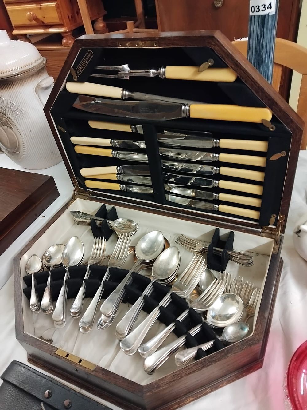 Lot 335 – A Cased Canteen of Silver Plated Flatware and Cutlery by The Orchid Cabinet