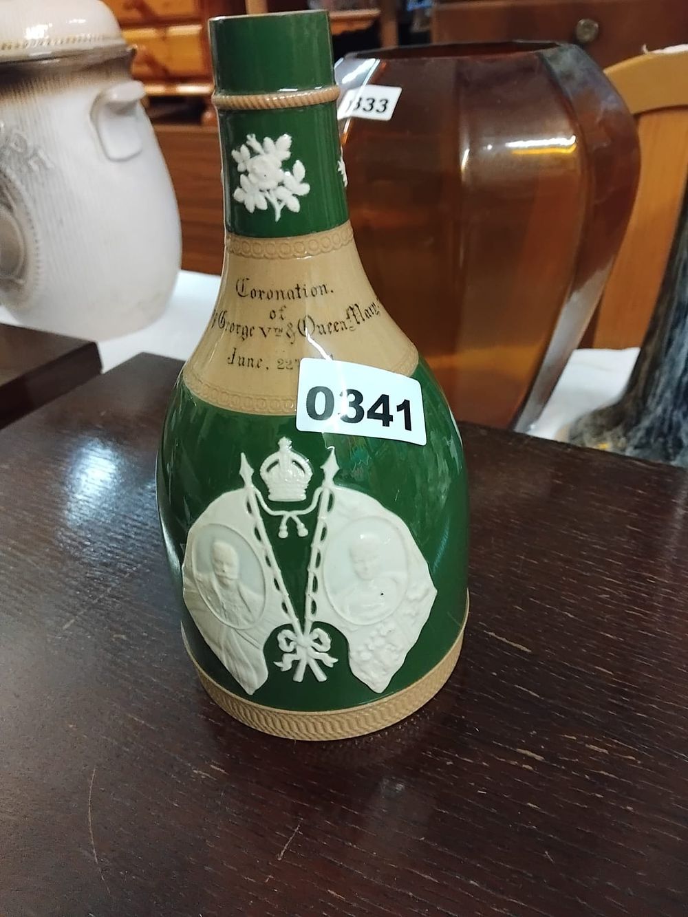 Lot 341 – A Royal Commemorative glazed stoneware whisky decanter for the coronation of King George V and Queen Mary, 1911