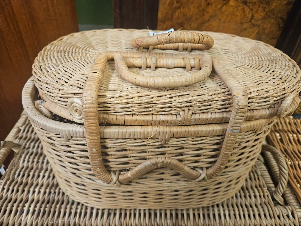 Lot 381 – A Woven Rattan Oval Picnic Basket with Dual Arched Handles