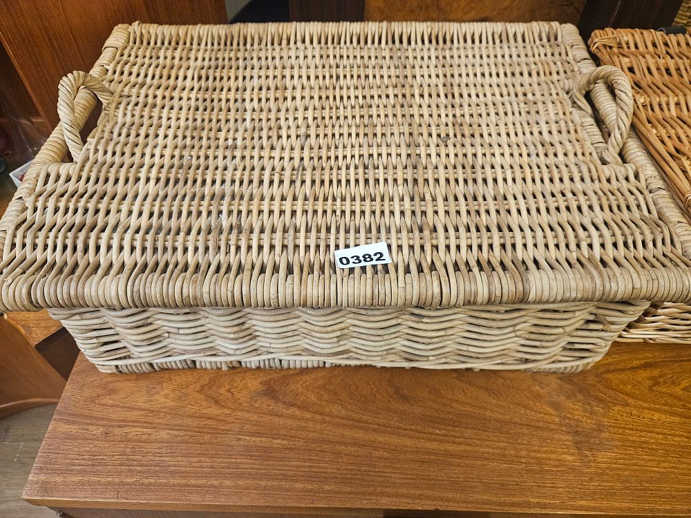 Lot 382 – A Large Woven Wicker Storage Basket with Lid and Handles