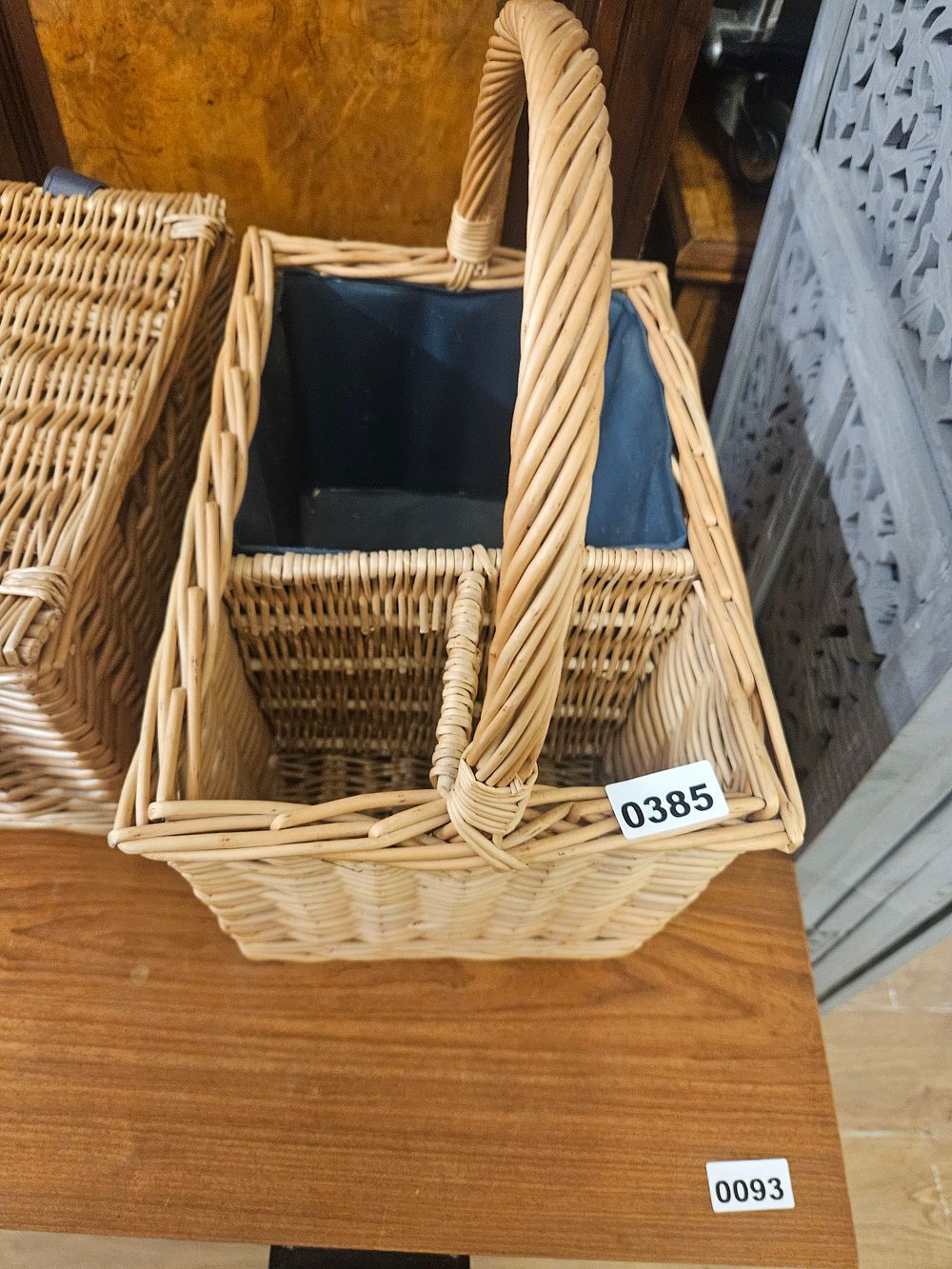 Lot 385 – Two Woven Wicker Baskets Including a Multi-Compartment Caddy