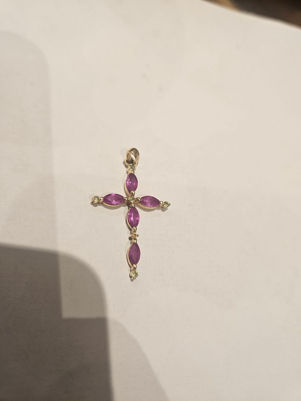Lot 434 – A 14 carat and marquise-cut pink gemstone cross pendant 1.9grams