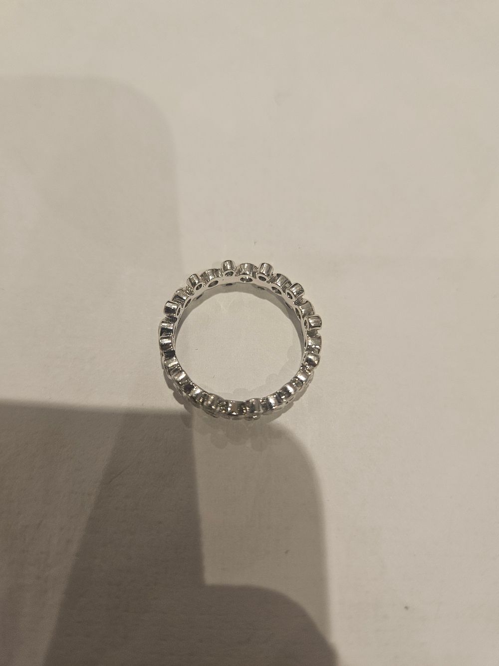 Lot 441 – A 9 Carat White Gold Scalloped Eternity Ring with diamonds 3grams