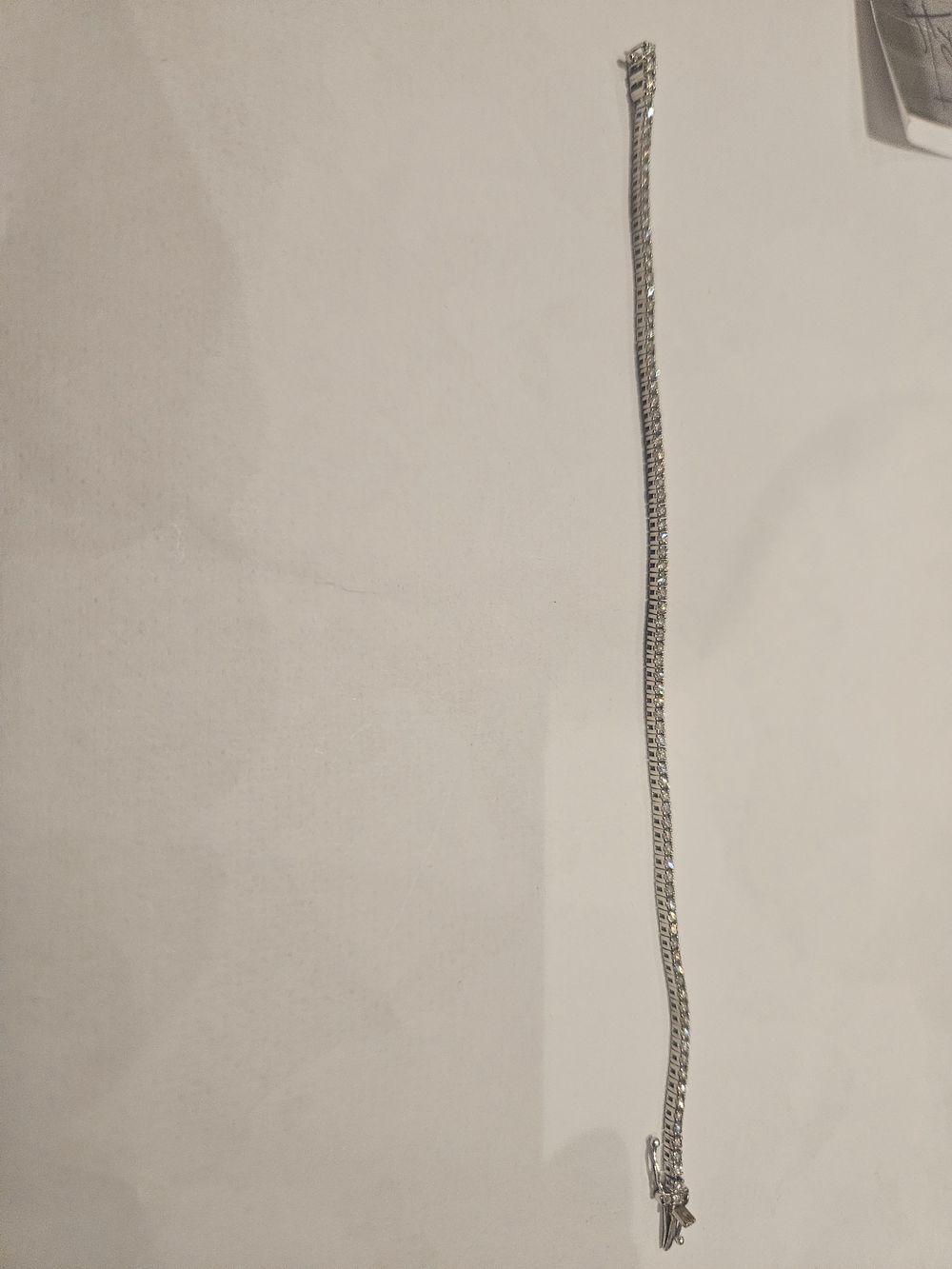 Lot 449 – An 18ct white gold bracelet with diamonds 5.6grams