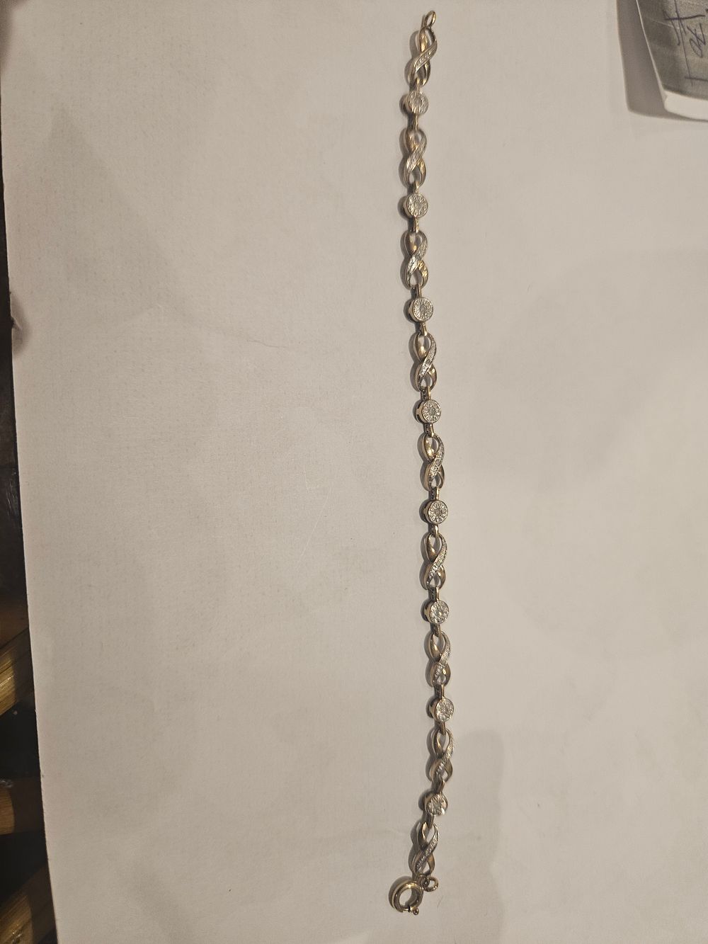 Lot 450 – A 9ct gold and diamond  link bracelet 5.2grams