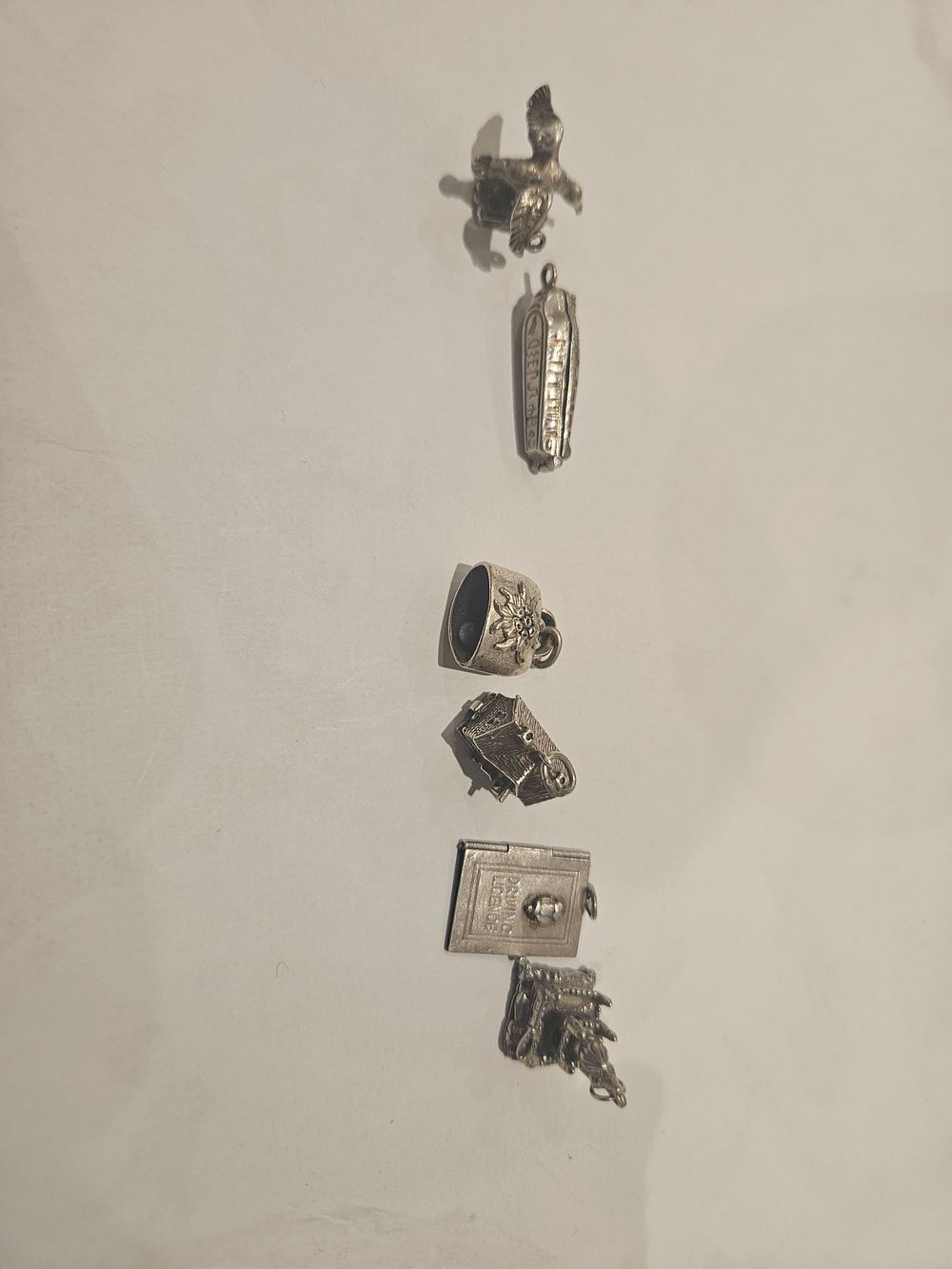Lot 451 – A Collection of Vintage Silver Figurative Charms 22.5grams