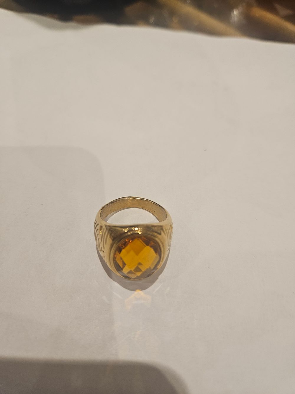 Lot 455 – A Yellow Metal and Citrine Men’s Signet Style Ring