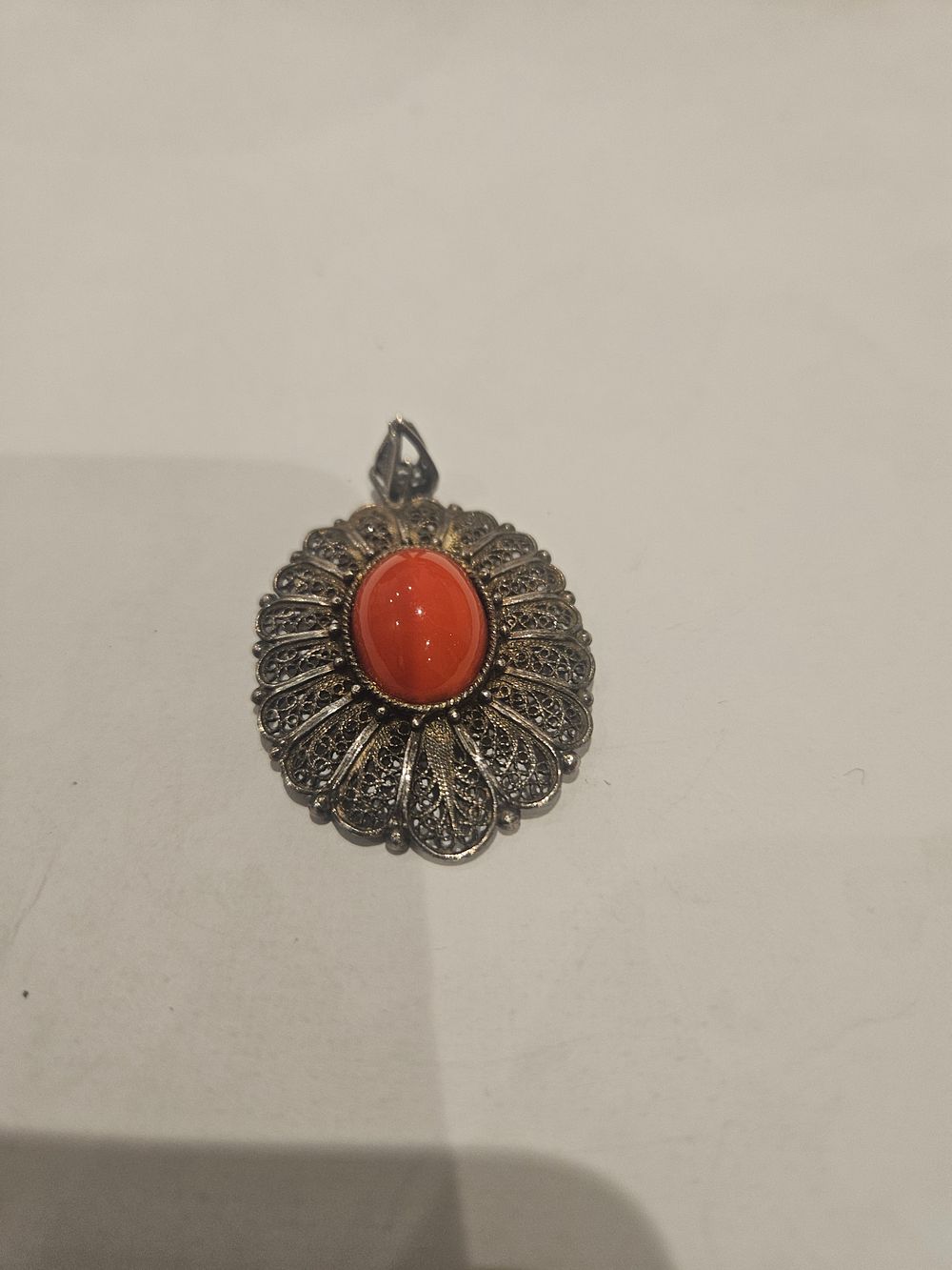 Lot 457 – Silver Filigree Pendant with Red Coral Cabochon 8.9grams