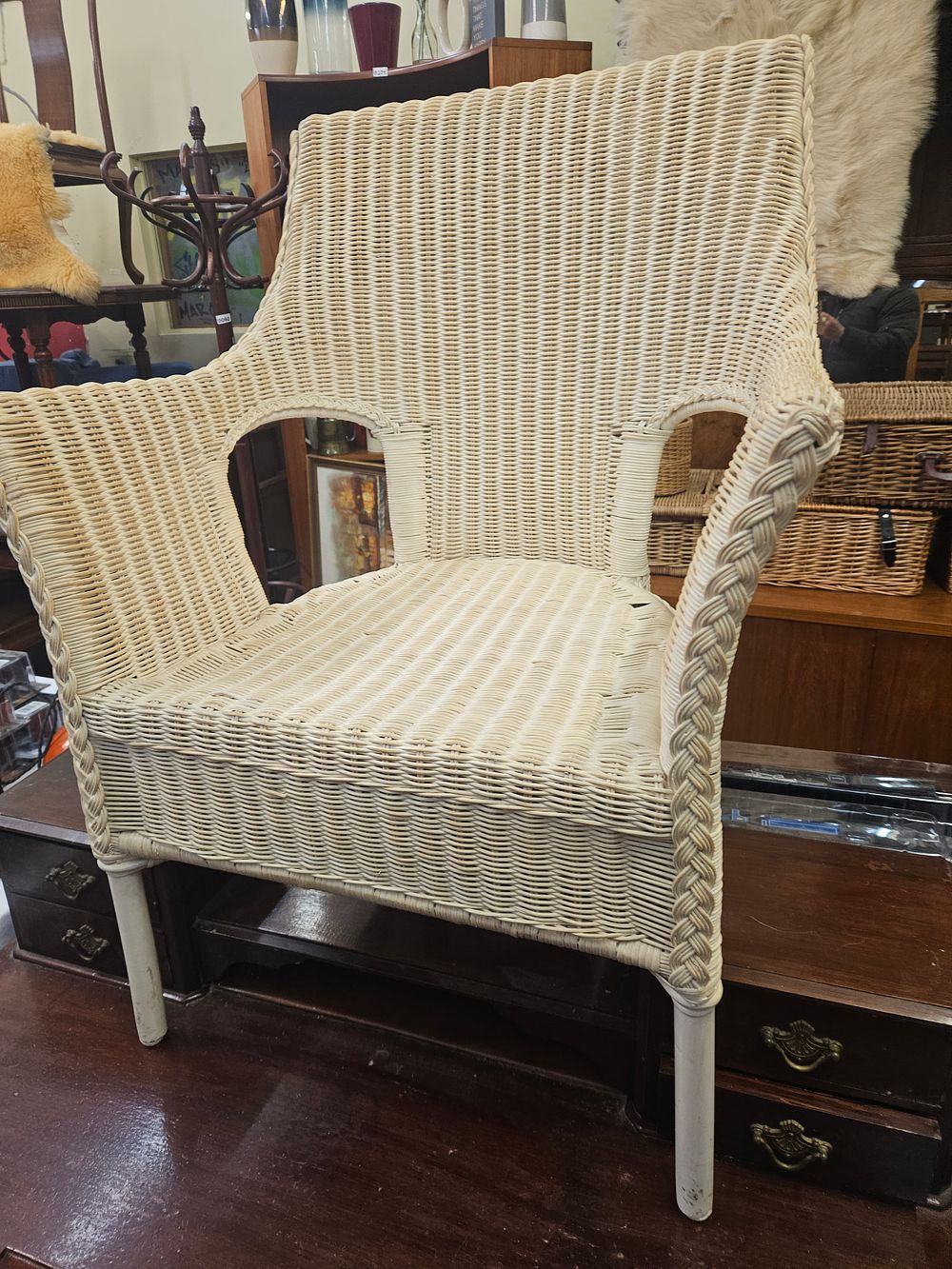 Lot 169 – A Mid-20th Century White-Painted Wicker Armchair in the Lloyd Loom Style