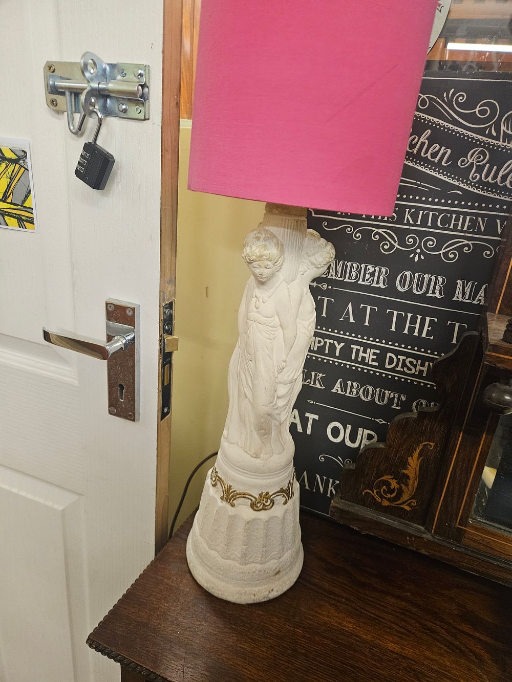 Lot 175 – A Neoclassical Style Cast Composite Figurative Table Lamp with Pink Fabric Shade