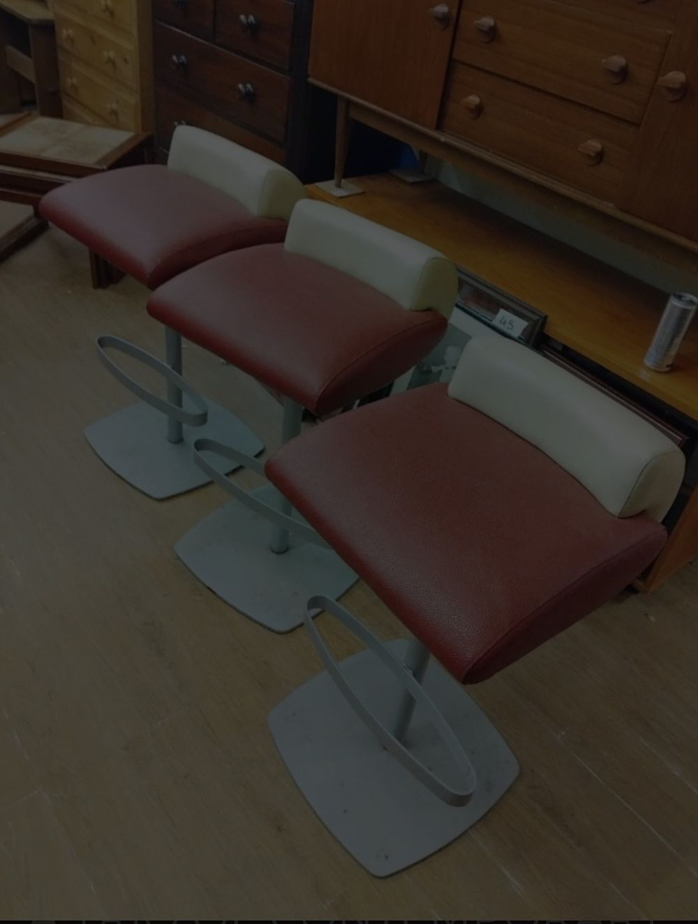 Lot 205 – A Trio of Postmodern Two-Tone Upholstered Bar Stools Attributed to Indecasa