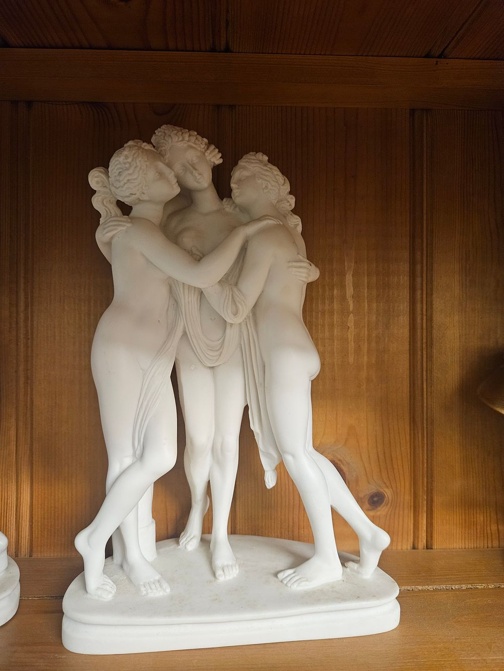Lot 229 – A white figure group of The Three Graces after Antonio Canova