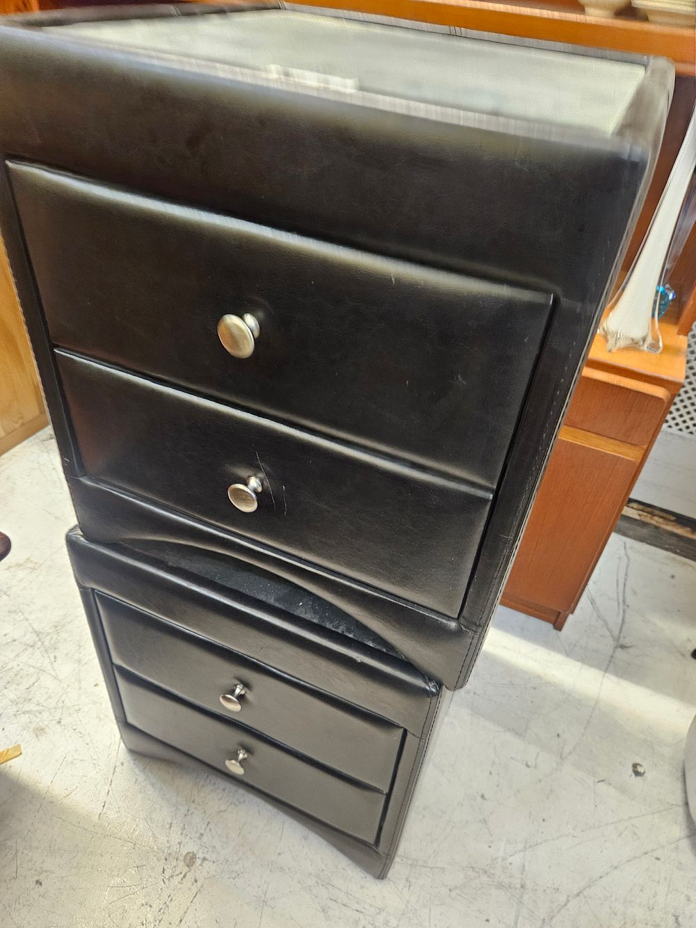 Lot 267 – A Pair of Contemporary Black Faux Leather Upholstered Two-Drawer Bedside Chests