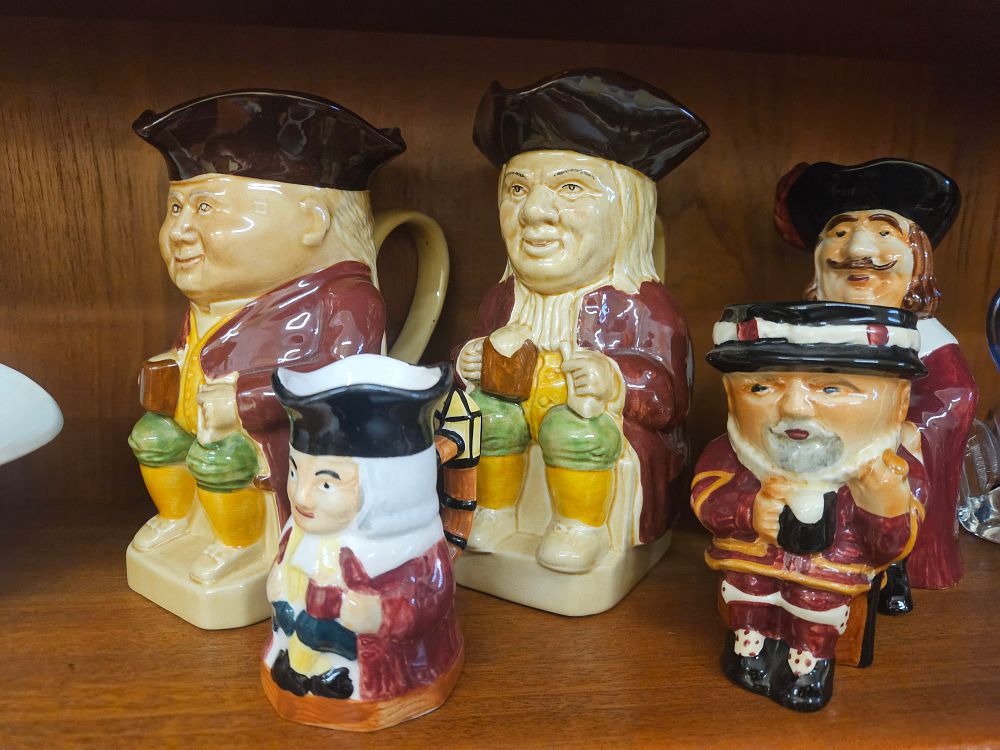 Lot 279 – A Collection of English Staffordshire Style Glazed Earthenware Toby and Character Jugs