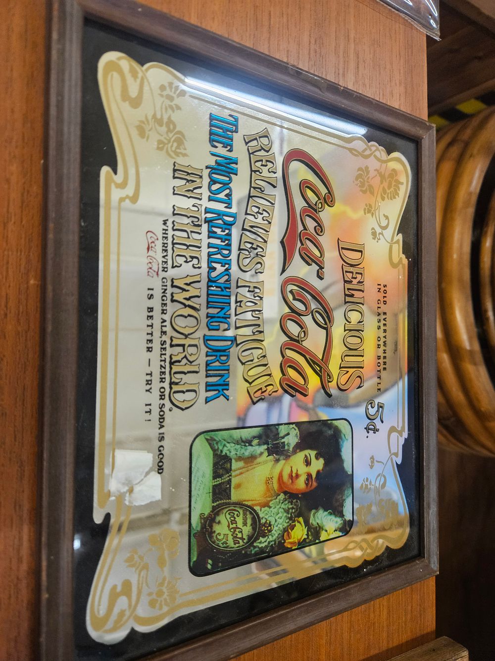 Lot 300 – Vintage Coca-Cola Framed Advertising Mirror featuring Hilda Clark Portrait