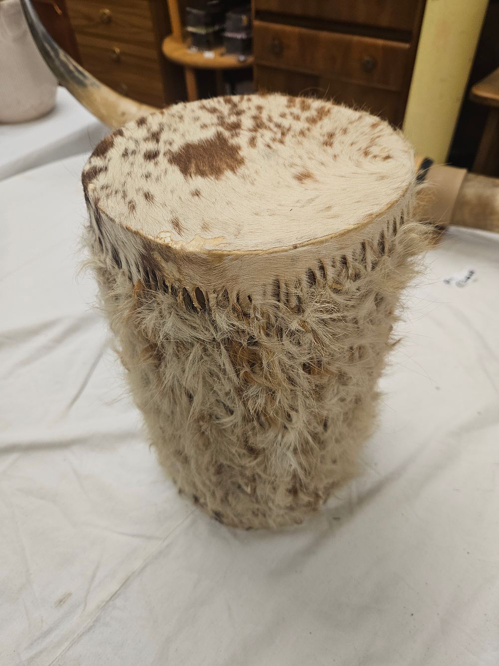 Lot 142 – A Small East African Tribal Hand Drum Covered in Animal Hide and Shaggy Fur
