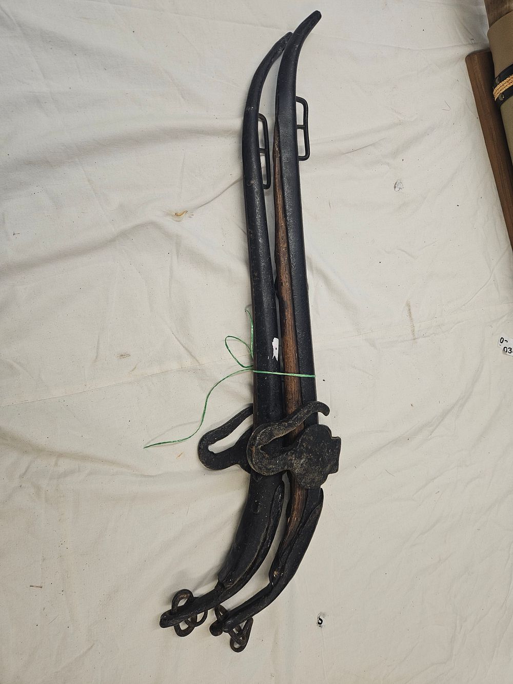 Lot 144 – A Pair of Antique Wrought Iron and Wood Horse Harness Hames