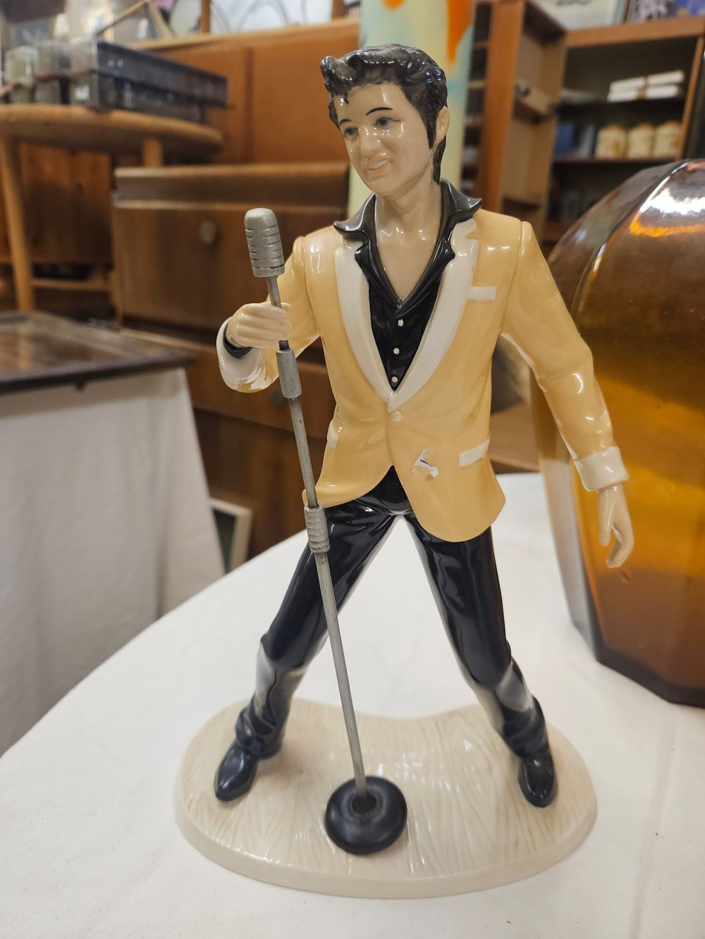 Lot 149 – Glazed ceramic figurine of Elvis Presley in performance pose