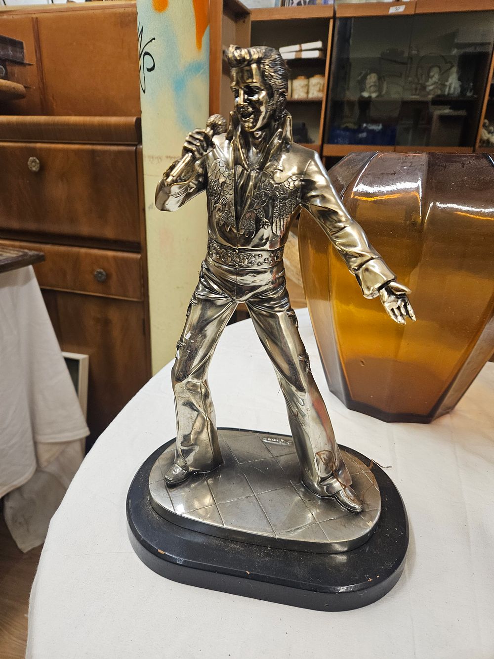 Lot 152 – Large Silver-Toned Cast Metal Elvis Presley Figurine, dated 1977