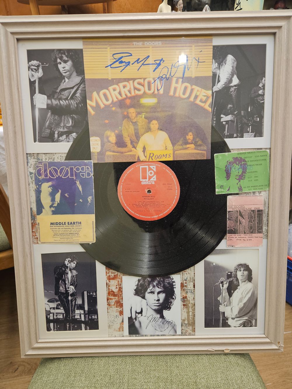 Lot 192 – A Framed Collection of The Doors Memorabilia Including Morrison Hotel Vinyl and Apparent Signatures reproduction