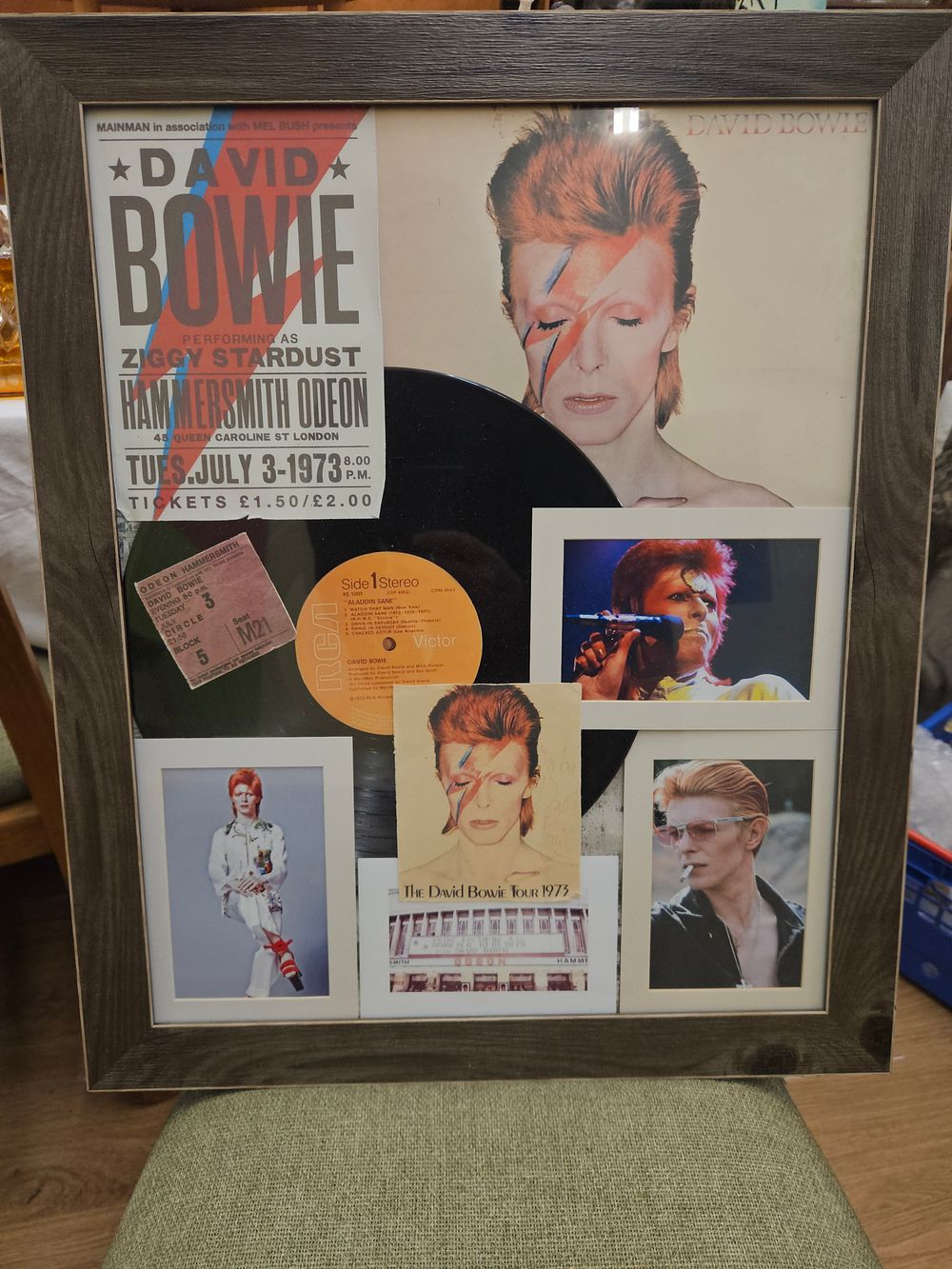 Lot 193 – A Framed Display of David Bowie Ziggy Stardust and Aladdin Sane Memorabilia reproduction