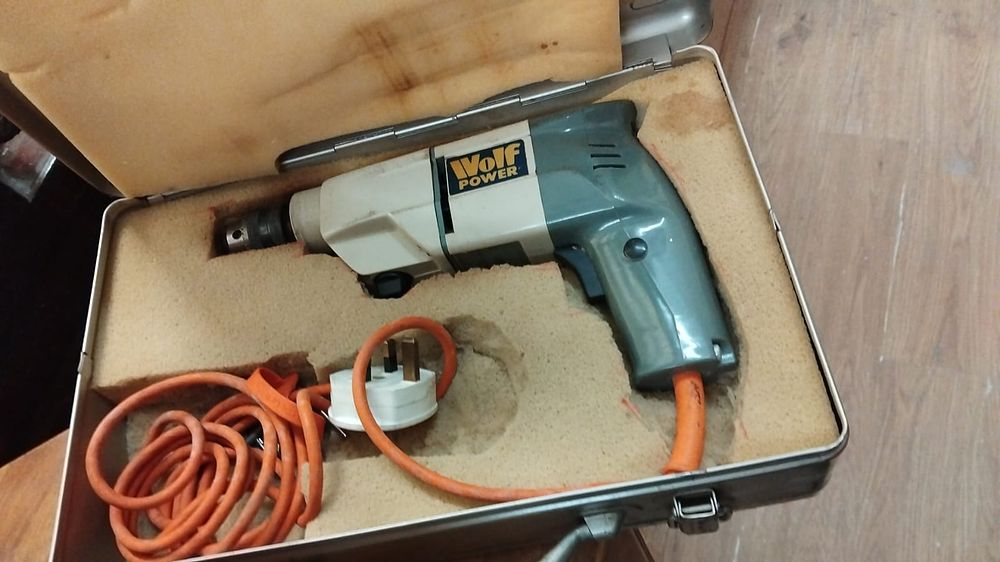 Lot 218 – A Wolf Power Corded Electric Hand Drill in Metal Carry Case