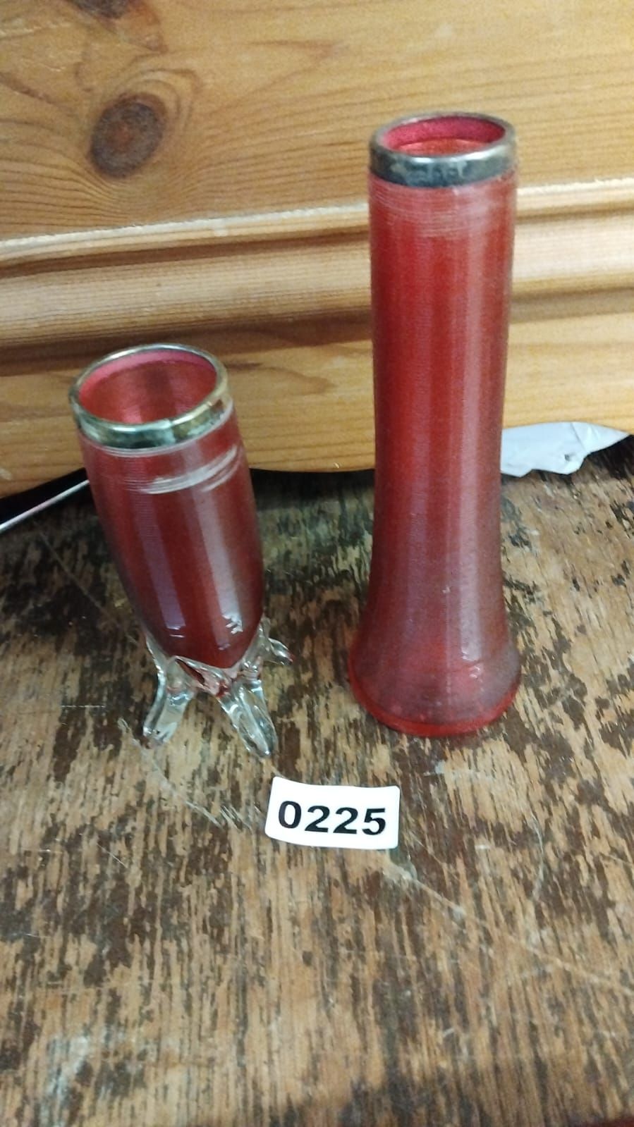 Lot 225 – A Pair of Late Victorian or Edwardian Ruby Glass Vases with silver Rims