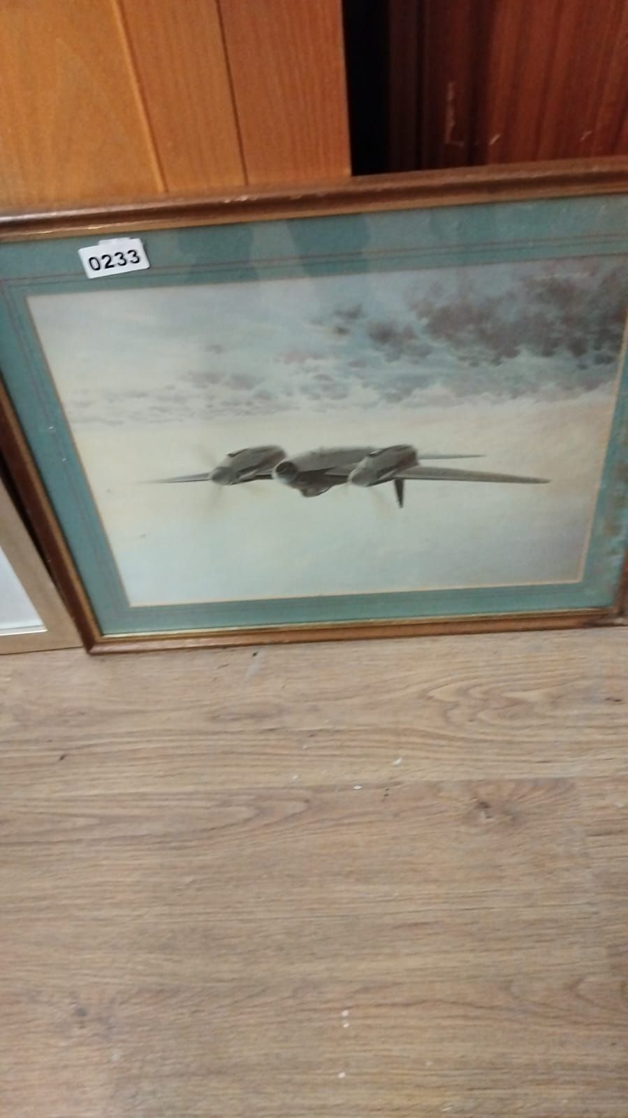 Lot 233 – A Framed Aviation Print After Robert Taylor Depicting a de Havilland Mosquito