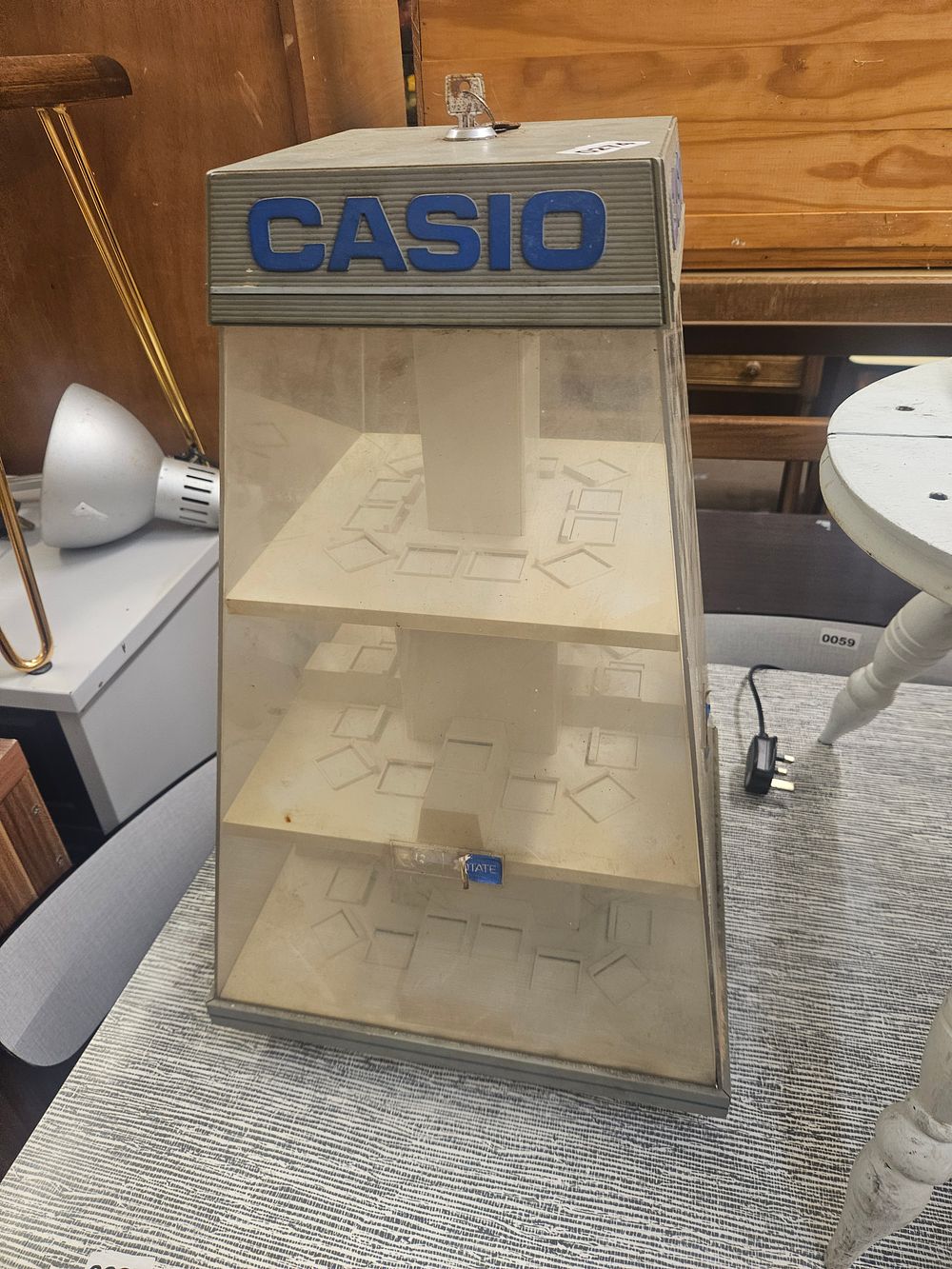 Lot 274 – A Vintage Casio Motorised Rotating Retail Watch Display Case