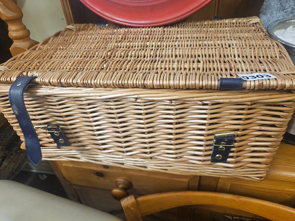 Lot 303 – A Wicker Picnic Hamper with Blue Leather Fastenings