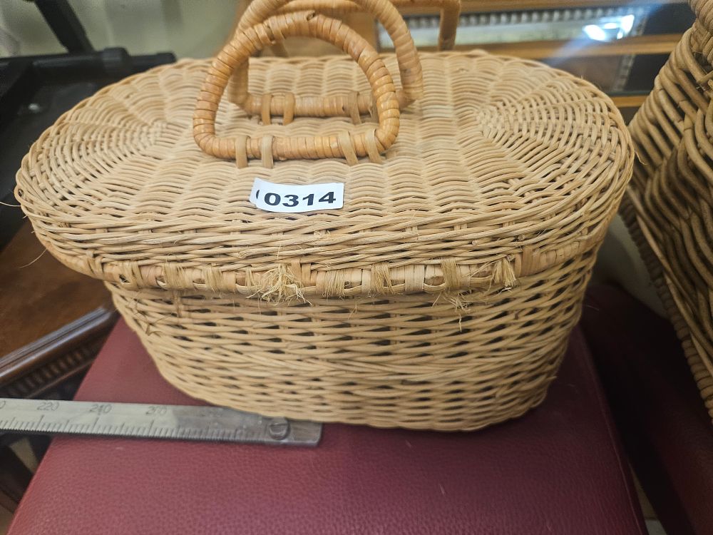 Lot 314 – A vintage woven wicker picnic basket with twin handles