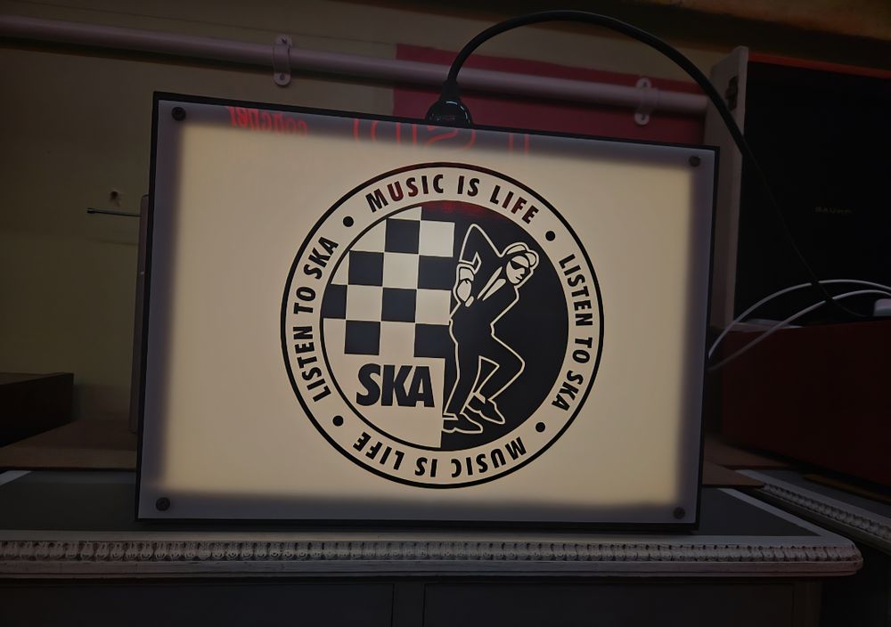 Lot 150a – Illuminated 2-Tone Ska Music Lightbox Sign with Walt Jabsco Mascot