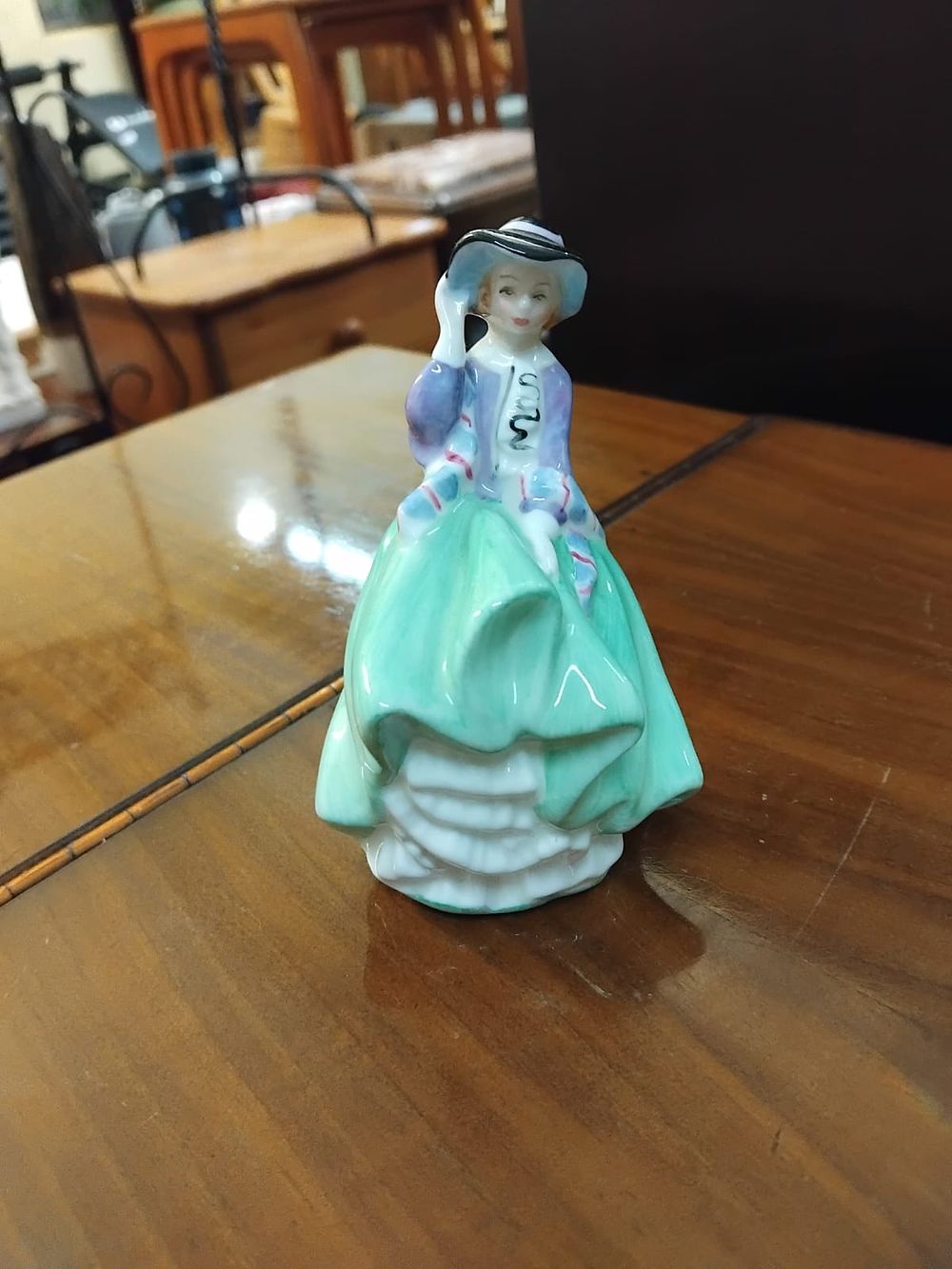 Lot 174 – A Royal Doulton Bone China Figurine Top o’ the Hill HN 2126