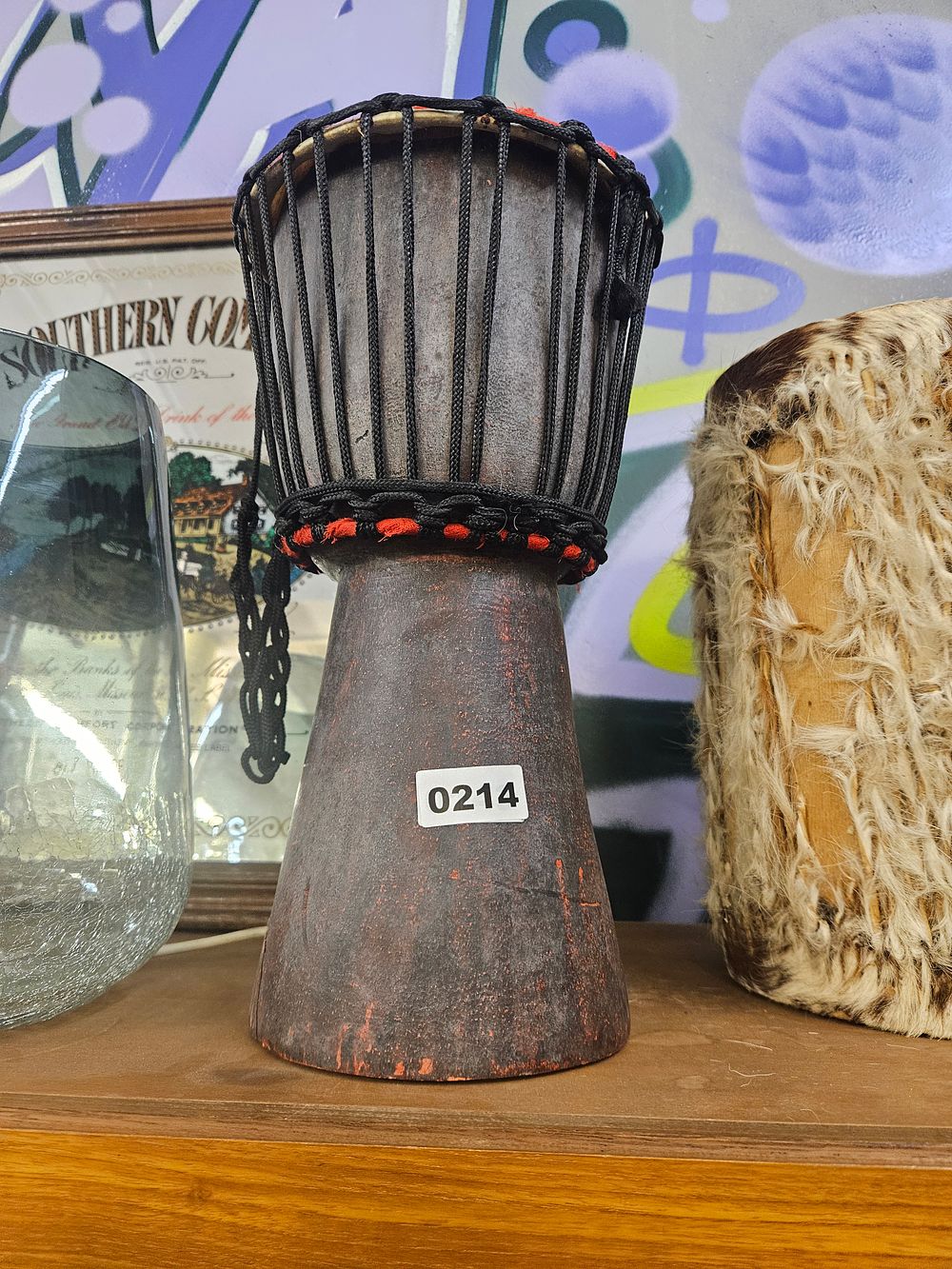 Lot 214 – A Miniature Hand-Carved African-Style Djembe Drum