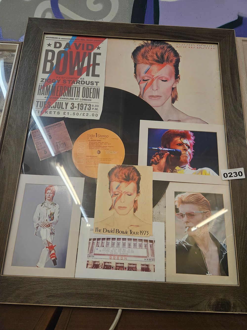 Lot 230 – A Framed David Bowie Commemorative Memorabilia Display for the 1973 Hammersmith Odeon Performance reproduction